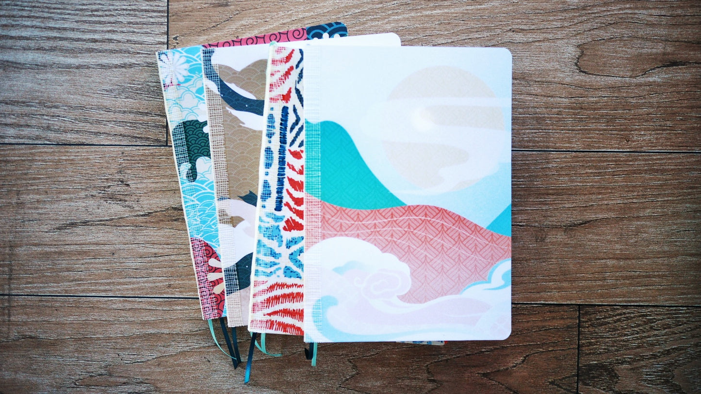 a5 colorful notebooks stacked together on the table